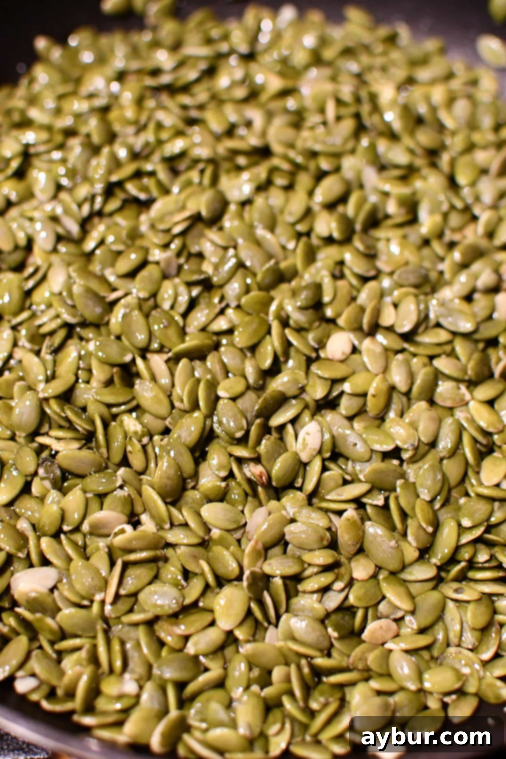 Garlicky Roasted Pumpkin Seeds 5 Warming the seeds in a skillet with oil.