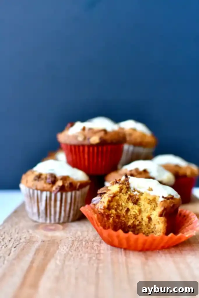 Homemade Starbucks-Inspired Pumpkin Cream Cheese Muffins 3 A plate of freshly baked copycat Starbucks pumpkin cream cheese muffins ready to be served