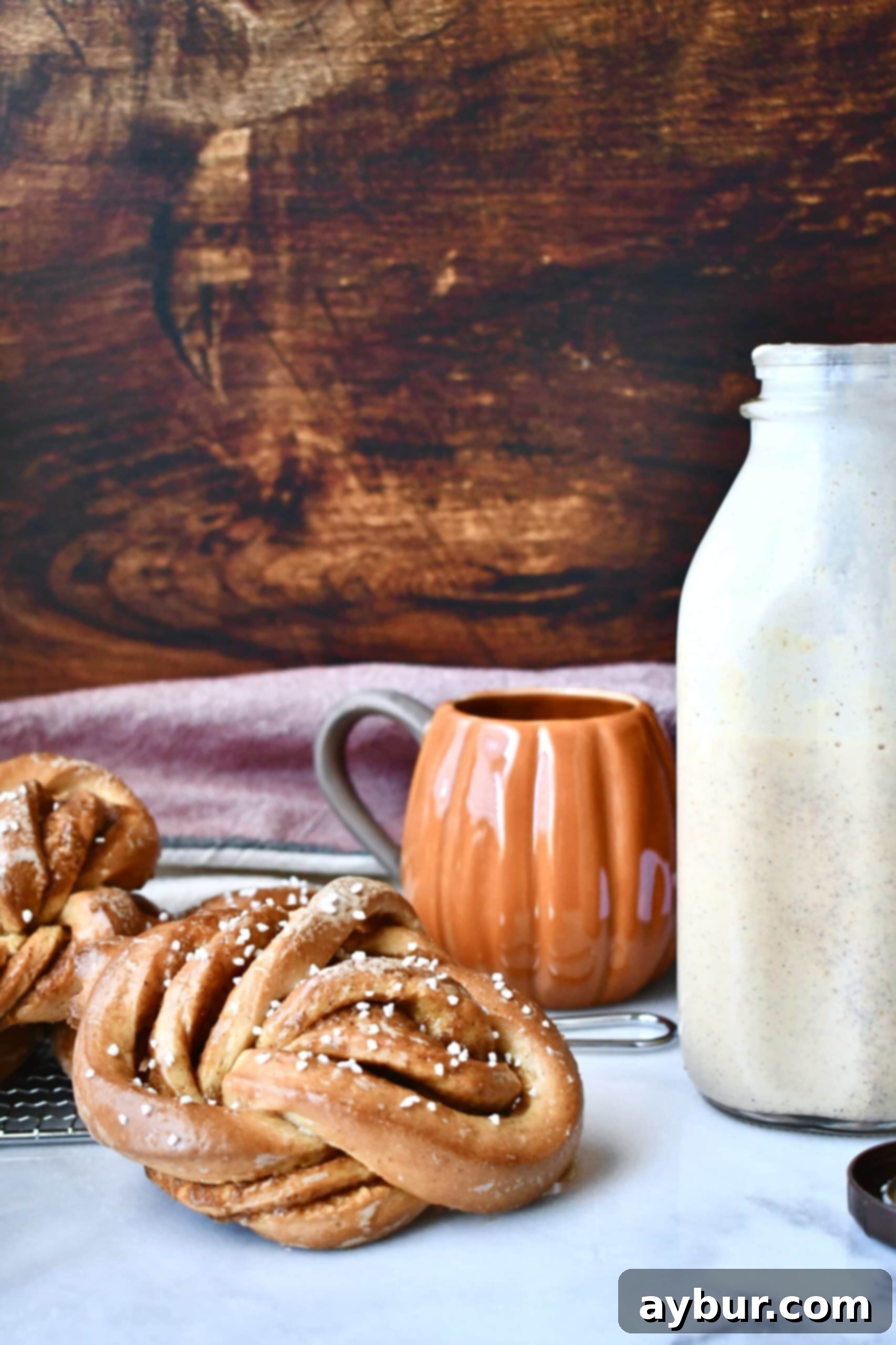 Pumpkin Buns and Homemade Pumpkin Spice Coffee Creamer in a glass
