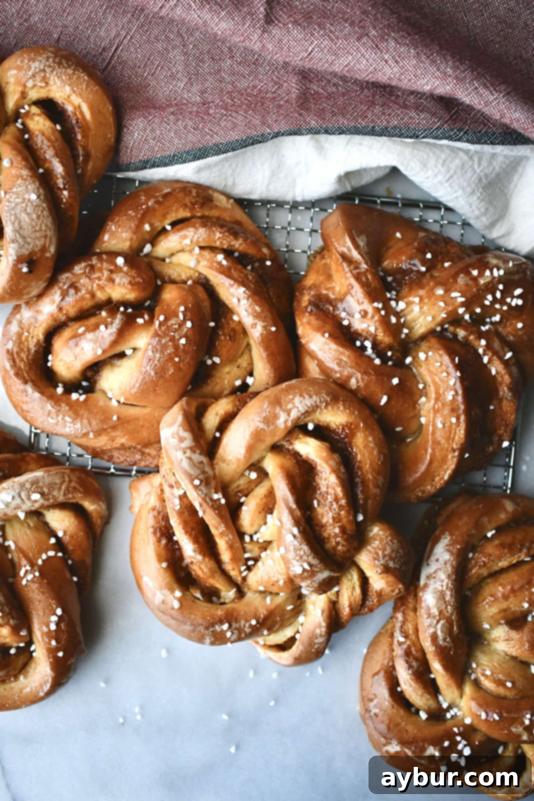 Close-up of a twisted pumpkin bun before baking