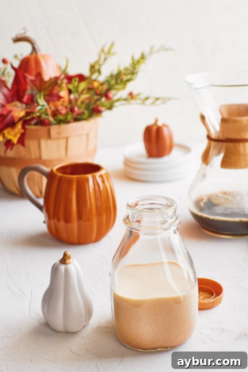 Pumpkin Spice Creamer 2 Freshly made Homemade Pumpkin Spice Coffee Creamer in a glass bottle with autumn decor
