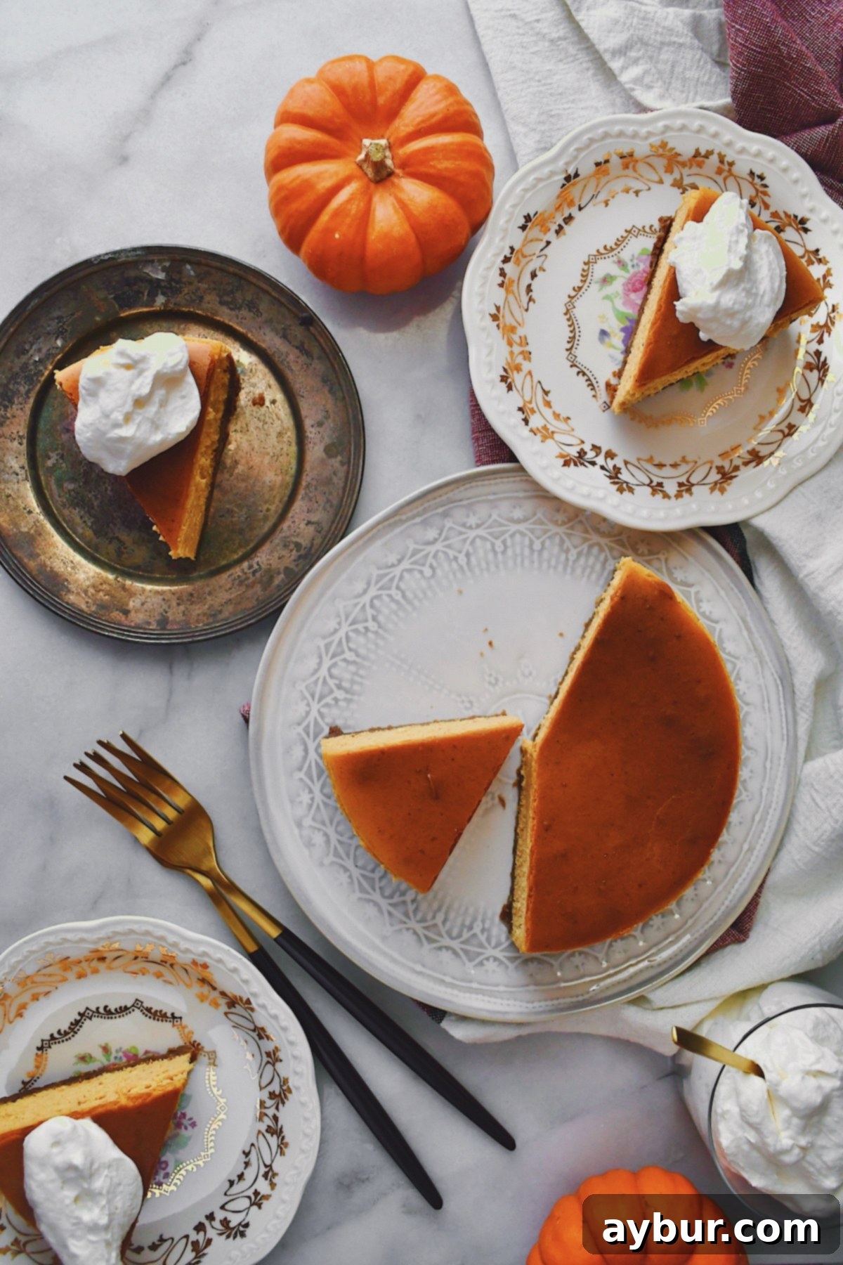 A close-up view of a perfectly baked pumpkin cheesecake, ready to be cooled and topped.