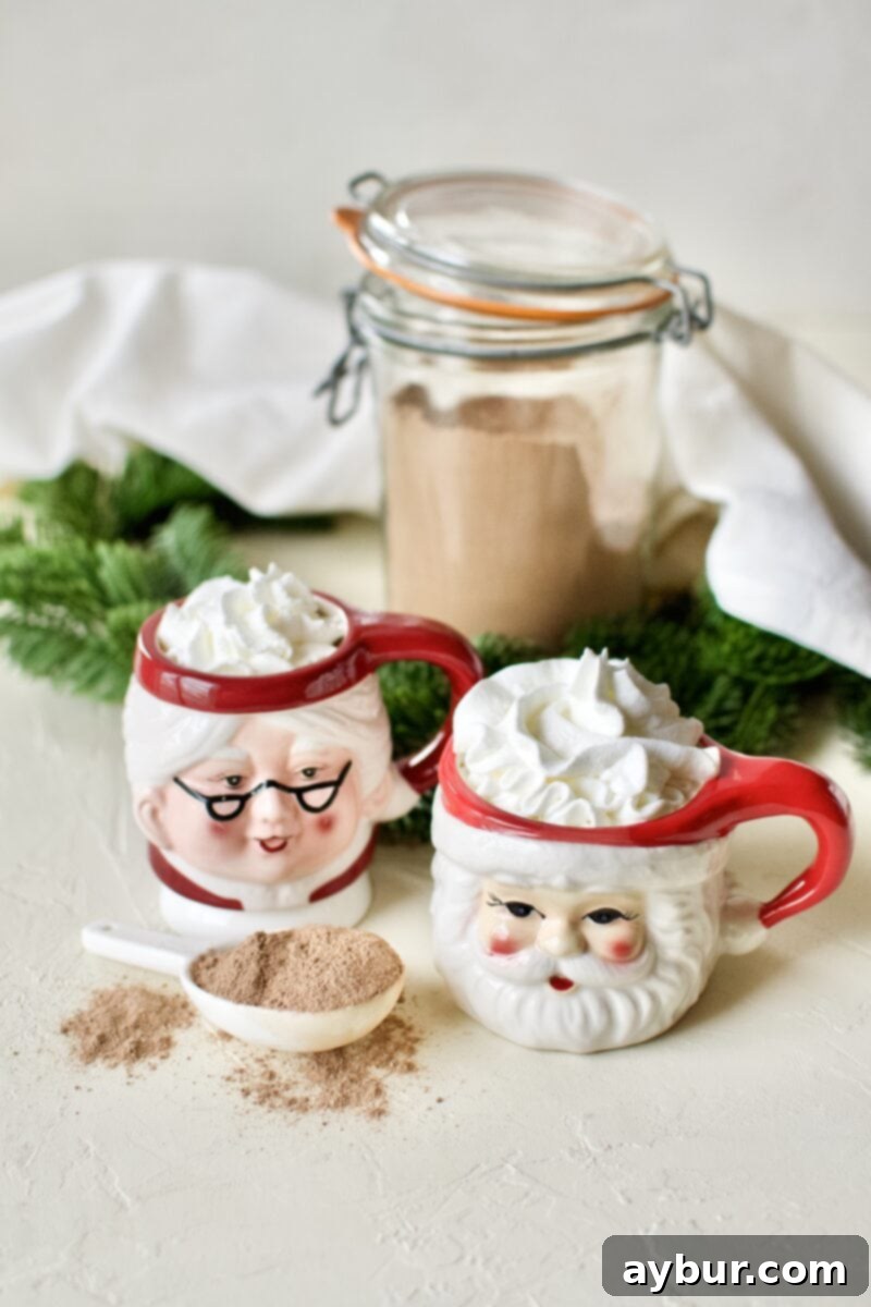Sweetened-Free Cocoa Delight 5 A glass of sugar-free hot cocoa in Santa and Mrs. Claus mugs topped with whipped cream.